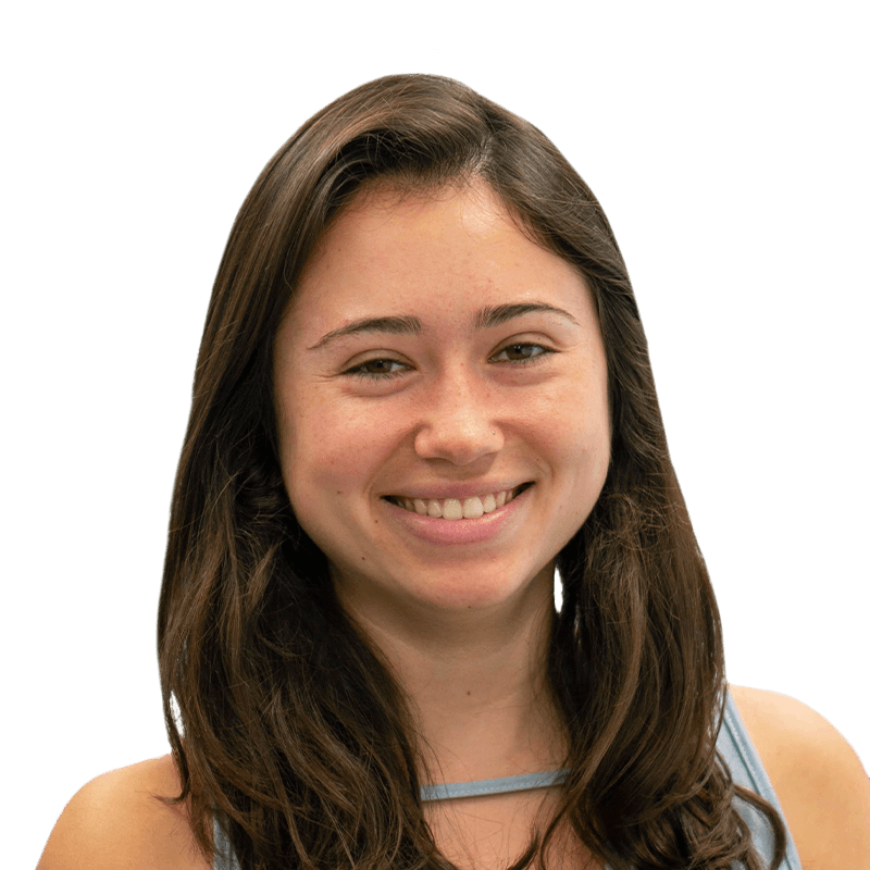 Headshot of Rachel Partridge, who is smiling and has brown wavy hair and is wearing a pale blue tank top