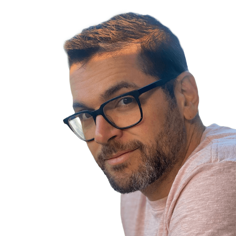 Headshot of Stephen Pantano, who is slightly smiling and is wearing glasses. He has short brown hair and a short beard. He is wearing a pink shirt.