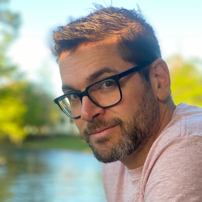 Headshot of Stephen Pantano, who is slightly smiling at the camera and wears glasses. He has short brown hair and short facial hair.